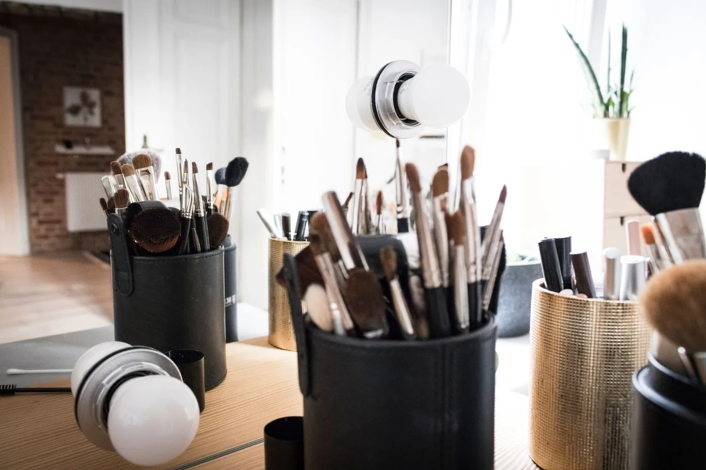 Makeup brushes arranged in an open brush case